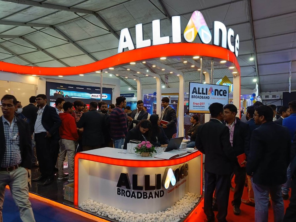 Alliance Broadband team meeting visitors at an exhibition booth